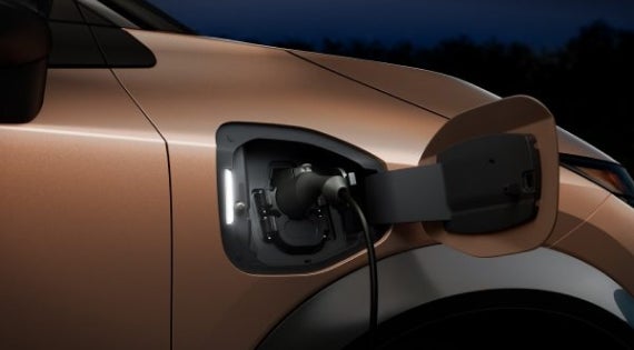 Close-up image of charging cable plugged in | Nissan of Fremont in Fremont CA